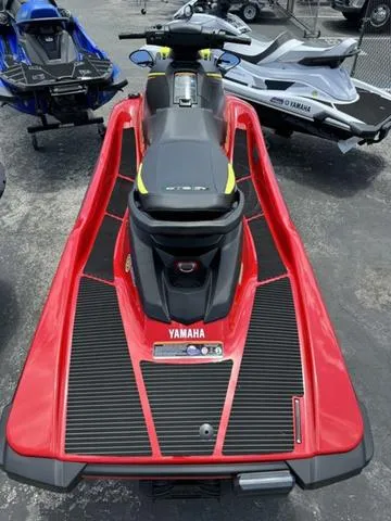 Slide: The Image of 2024 Yamaha WaveRunner EX in vibrant red, parked outdoors. - 7