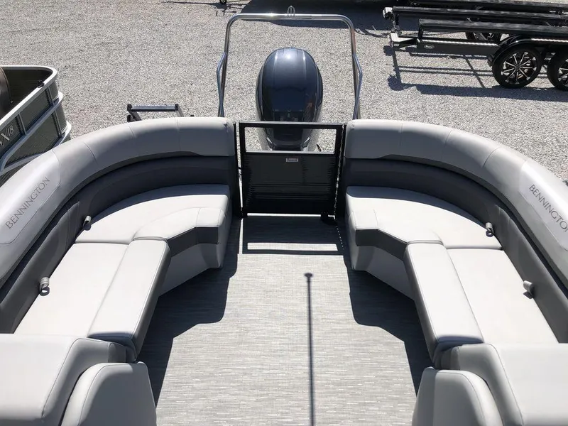 Slide: The Image of 2022 Bennington 22 SSRX pontoon boat with spacious seating and modern design. - 6