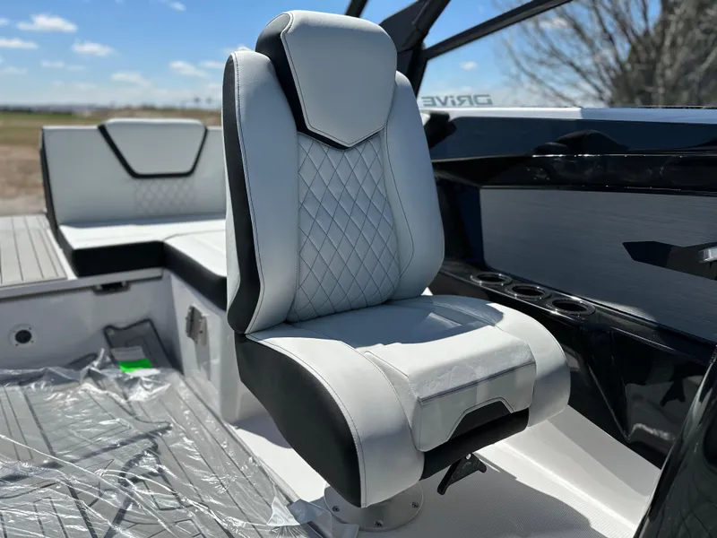 Slide: The Image of 2025 Yamaha Boats 222SD interior with modern, cushioned seating and sleek design. - 10