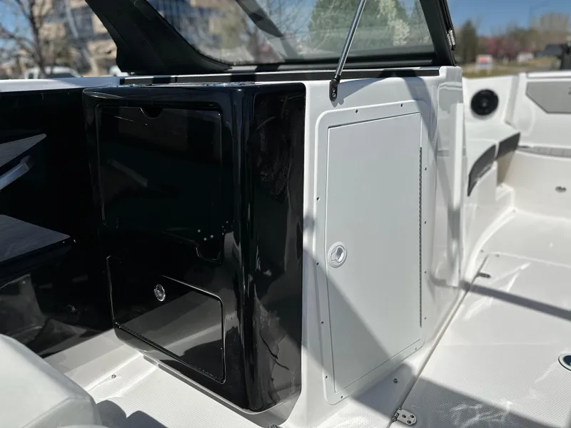 Slide: The Image of 2025 Yamaha Boats 222SD interior detail, featuring sleek black and white design elements. - 13