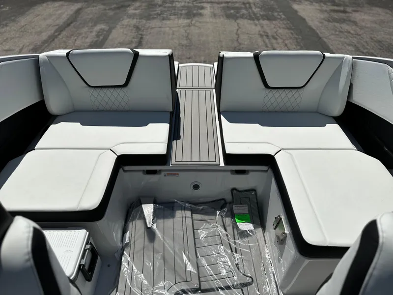 Slide: The Image of 2025 Yamaha Boats 222SD interior with white cushioned seating and sleek design. - 16