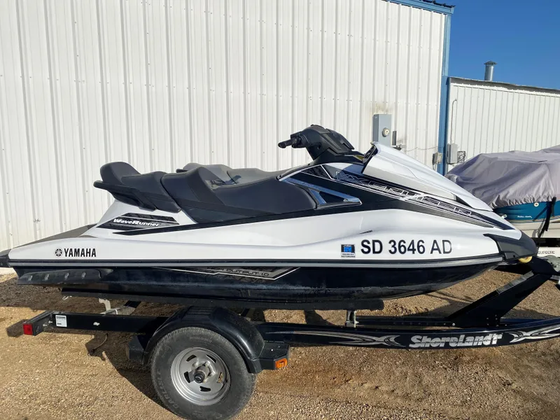 Slide: The Image of 2016 Yamaha WaveRunner personal watercraft on trailer, parked outdoors. - 2