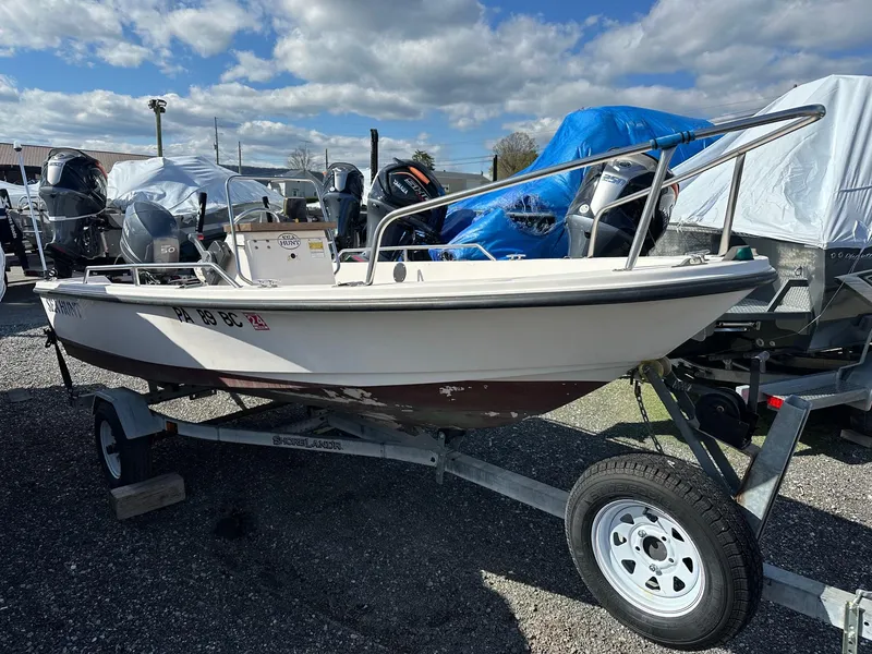 Slide: The Image of 1996 Sea Hunt 15' fiberglass center console boat with Yamaha 50Hp 4-stroke on trailer. - 3