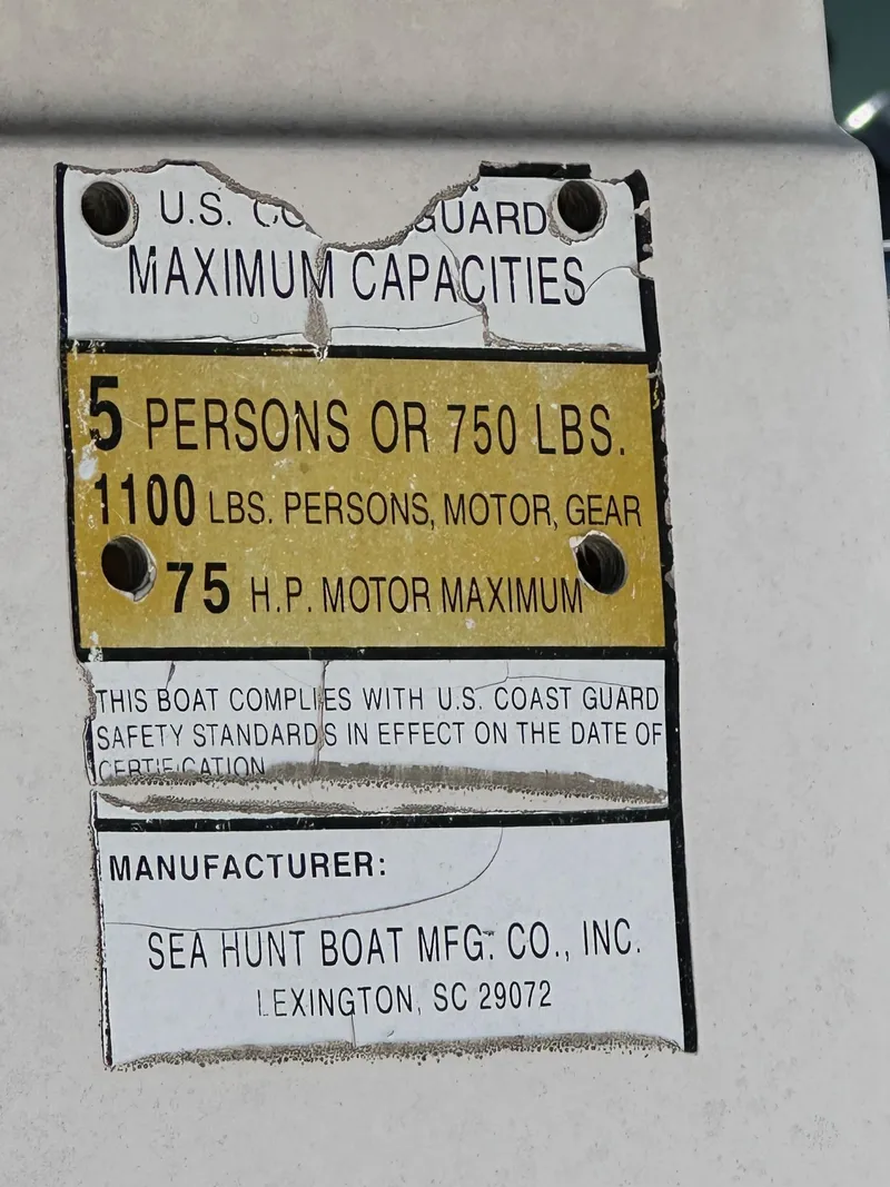 Slide: The Image of U.S. Coast Guard capacity label for Sea Hunt boat, 5 persons or 750 lbs, 75 HP motor. - 4