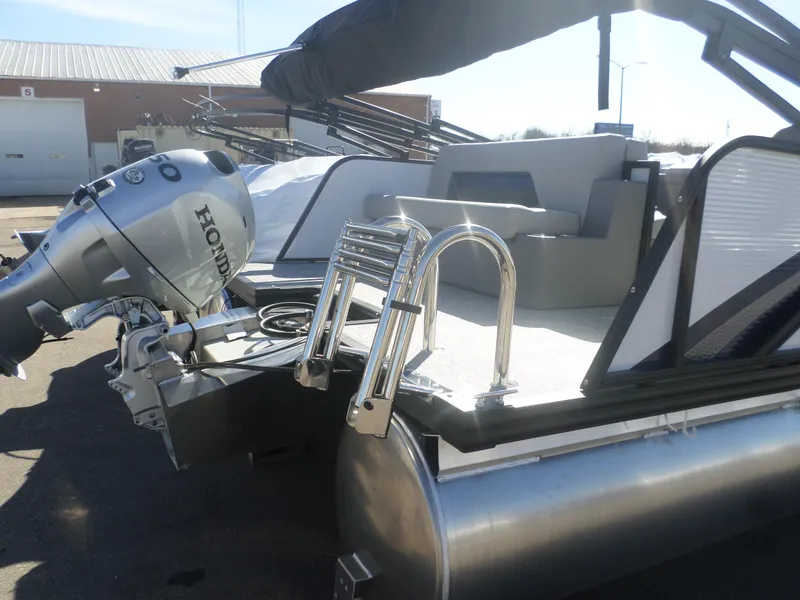 Slide: The Image of 2025 Apex Qwest 818 Lanai pontoon boat with Honda outboard motor and ladder. - 5