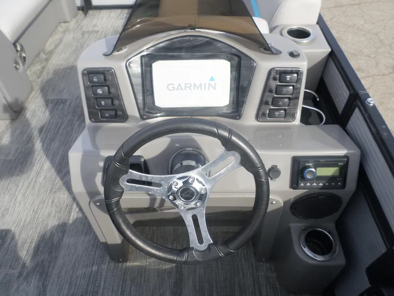 Slide: The Image of Steering console of 2022 Apex Qwest 818 Lanai LTZ TRI with Garmin display. - 3