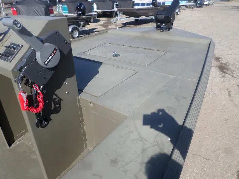 Slide: The Image of 2022 Gator Trax 1862 BIG Water boat deck with Yamaha controls, parked outdoors. - 4