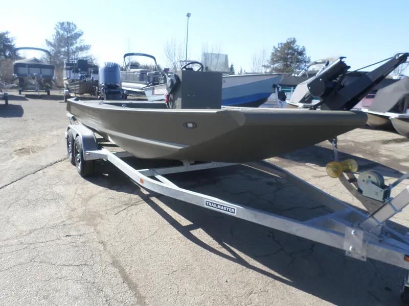 Slide: The Image of 2022 Gator Trax 1862 BIG Water boat on a trailer in a parking lot. - 6