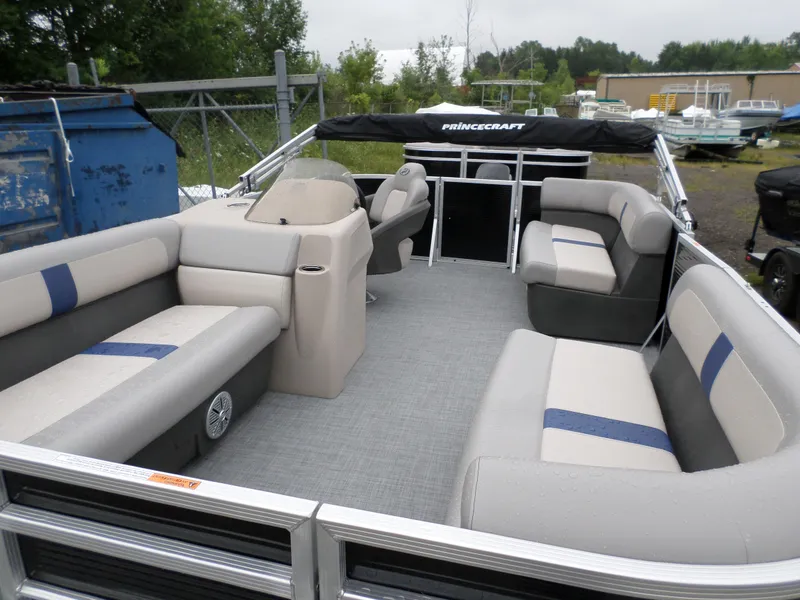 Slide: The Image of 2024 Princecraft Jazz 170 pontoon boat with spacious seating and modern design. - 3