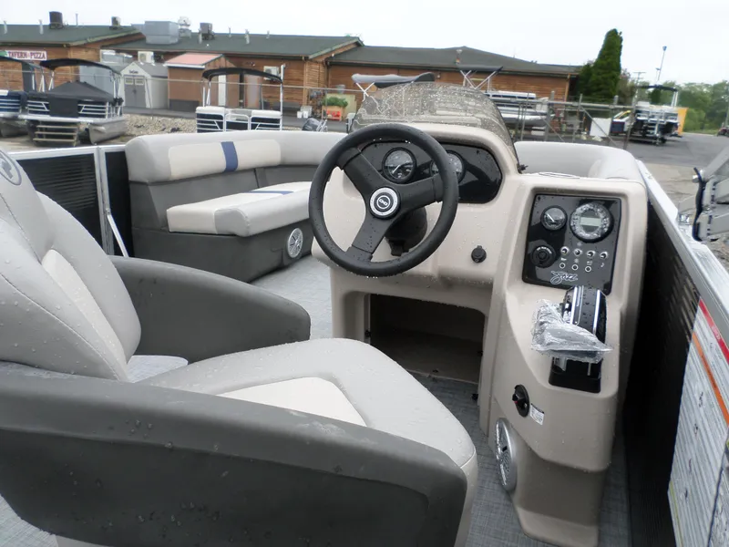 Slide: The Image of 2024 Princecraft Jazz 170 boat interior with steering wheel and seating. - 6
