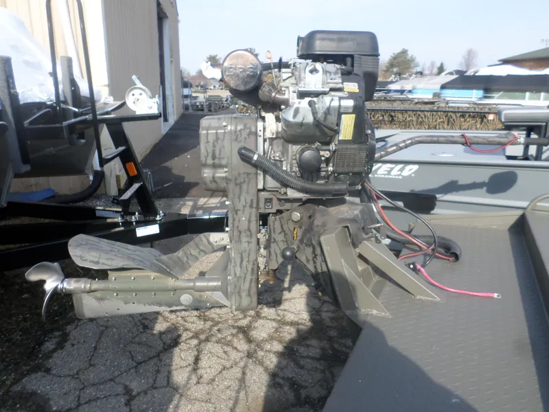 Slide: The Image of 2024 Gator Trax 1862 4 Man Hide boat motor, outdoor setting, close-up view. - 5