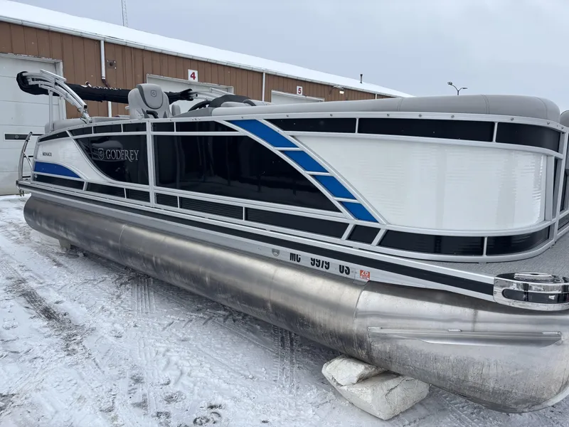 Slide: The Image of 2022 Godfrey Monaco 235 SB pontoon boat on snowy ground, side view. - 3