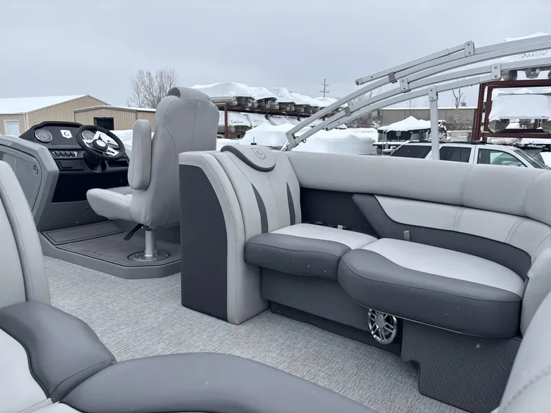 Slide: The Image of 2022 Godfrey Monaco 235 SB pontoon boat interior with gray seating and steering console. - 7
