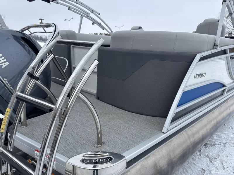 Slide: The Image of 2022 Godfrey Monaco 235 SB pontoon boat with Yamaha engine, docked on snowy surface. - 8