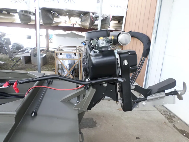 Slide: The Image of 2024 Gator Trax 16 Marsh Series boat motor in a storage area. - 6
