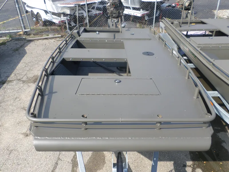 Slide: The Image of 2024 Gator Trax 1862 3 Man Hide boat, featuring a flat deck and sturdy railings. - 3