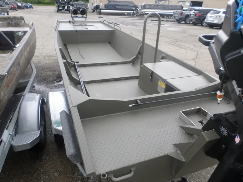 Slide: The Image of 2024 Gator Trax 1544 boat, gray, parked on a trailer in a lot. - 5