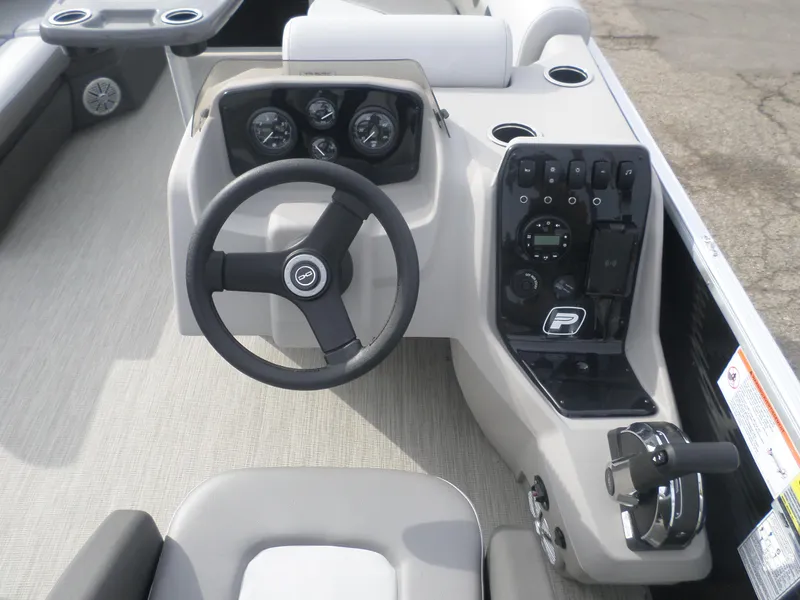 Slide: The Image of 2025 Princecraft Vectra19 L boat dashboard with steering wheel and control panel. - 4
