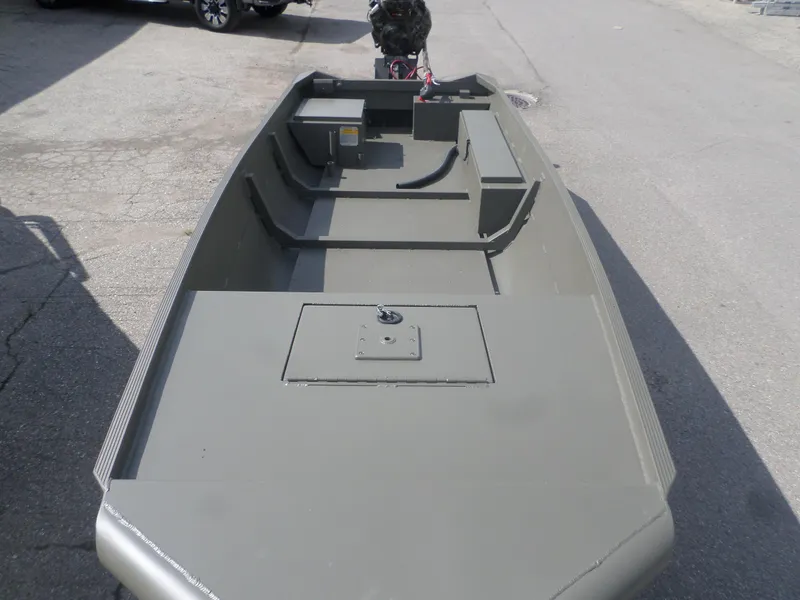 Slide: The Image of 2024 Gator Trax 1644 GE boat, olive green, parked on pavement. - 3