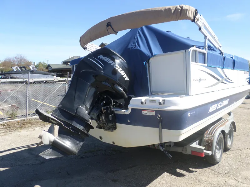 Slide: The Image of 2012 Hurricane 236 Fun Deck boat with Mercury outboard motor on trailer. - 6