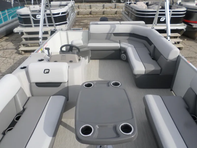 Slide: The Image of 2025 Princecraft Vectra 19 L pontoon boat interior with gray seating and table. - 4