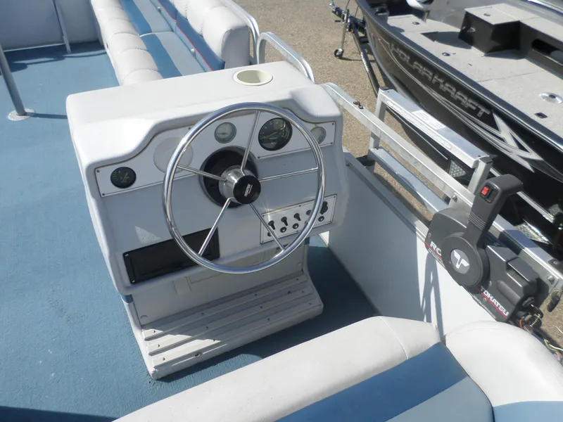 Slide: The Image of Steering console of a 1994 Manitou 24 boat with gauges and controls. - 6