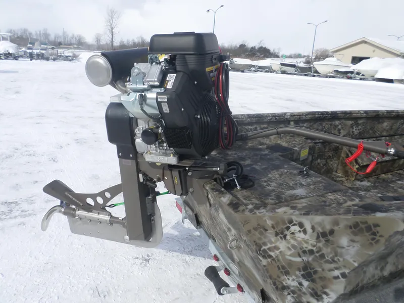 Slide: The Image of 2025 Excel 1554 Eclipse boat with powerful outboard motor on snowy ground. - 4