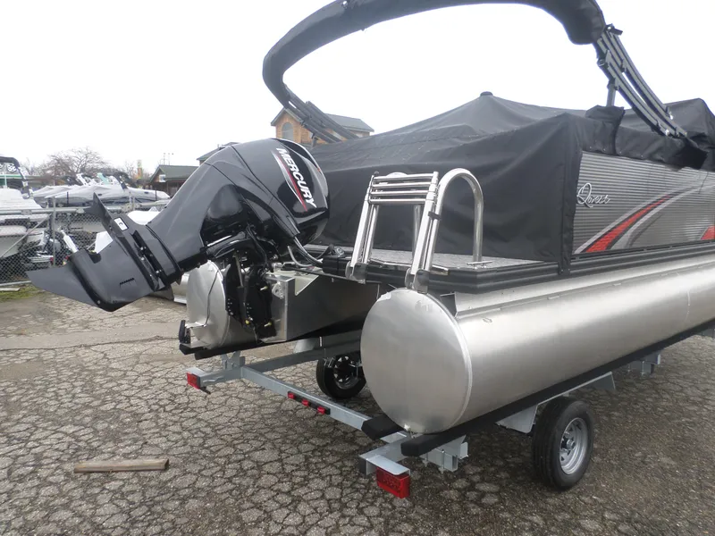 Slide: The Image of 2024 Apex Qwest 8516 Lanai pontoon boat with Mercury outboard motor on trailer. - 4
