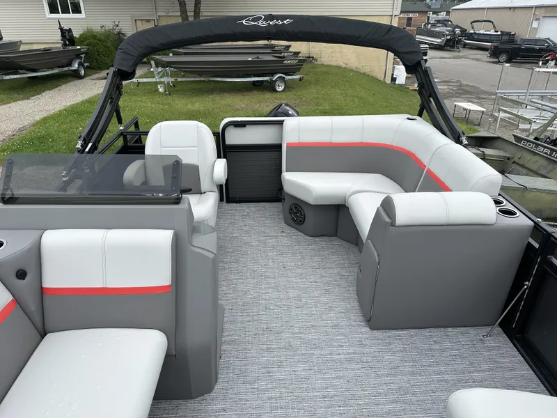Slide: The Image of 2024 Apex Qwest 8516 Lanai pontoon boat interior with gray and white seating. - 5