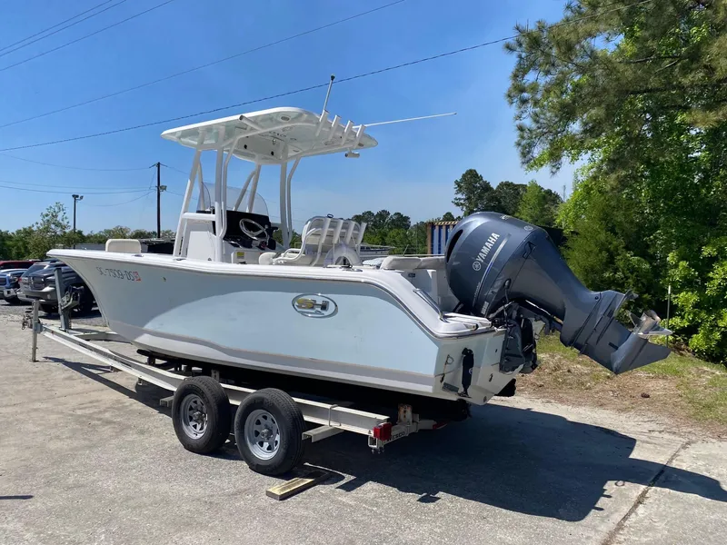 Slide: The Image of 2022 Sea Hunt Ultra 229 boat on trailer with Yamaha outboard motor. - 26