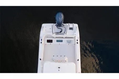 Slide: The Image of 2022 Sea Hunt Ultra 229 boat, aerial view, on calm water. - 4