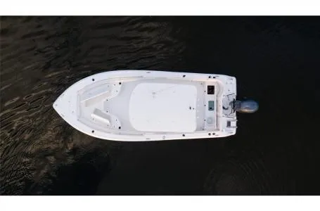 Slide: The Image of 2022 Sea Hunt Ultra 229 boat, aerial view on dark water. - 9