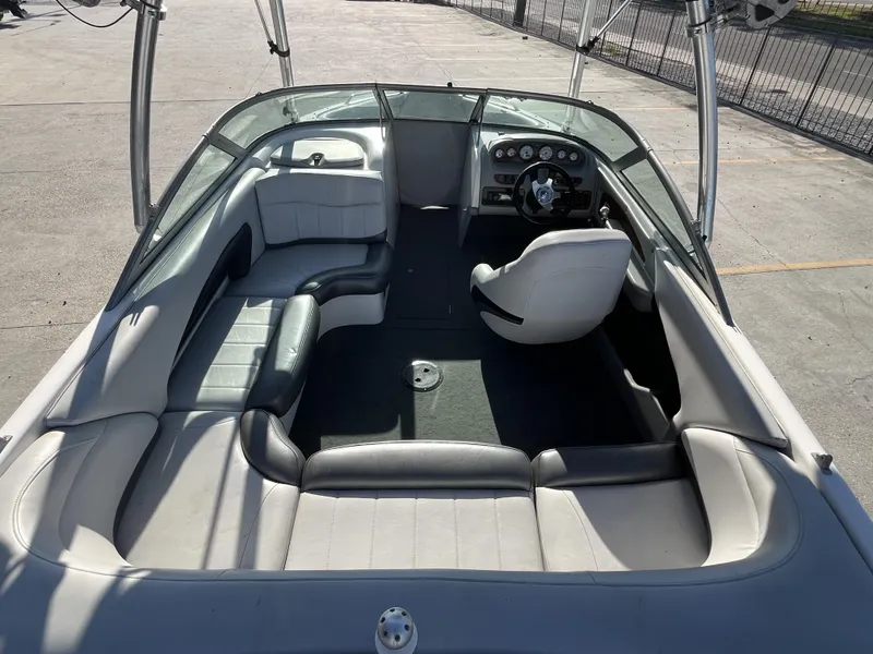 Slide: The Image of 2006 MasterCraft MariStar 210 boat interior with seating and steering wheel. - 4