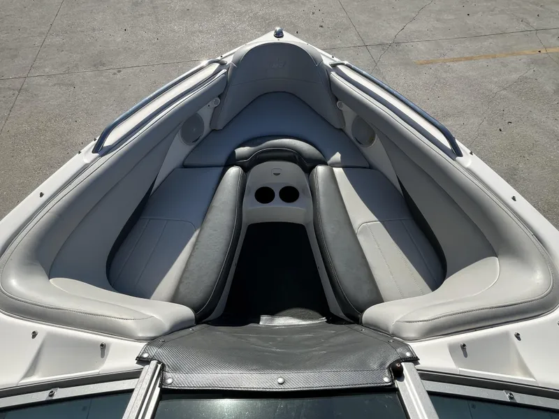 Slide: The Image of 2006 MasterCraft MariStar 210 boat interior with gray seating and cup holders. - 5