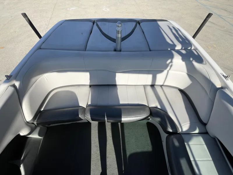 Slide: The Image of 2006 MasterCraft MariStar 210 boat interior with gray seating and sun pad. - 9