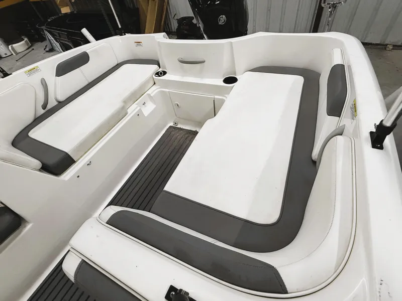 Slide: The Image of 2022 Bayliner Element E18 boat interior with white and gray seating. - 3