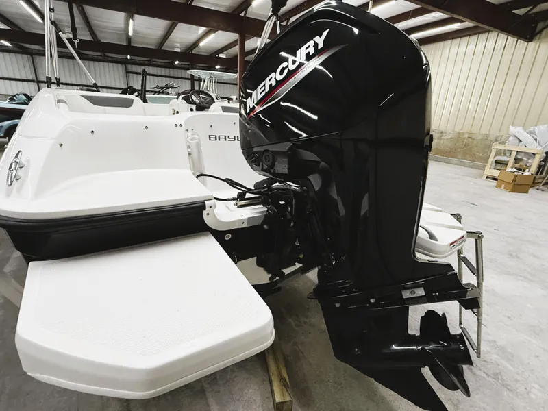 Slide: The Image of 2022 Bayliner Element E18 with Mercury outboard motor in a showroom. - 4