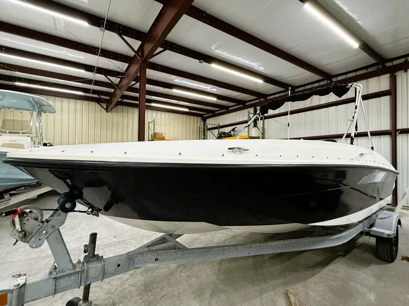 Slide: The Image of 2022 Bayliner Element E18 boat on trailer in indoor storage facility. - 5