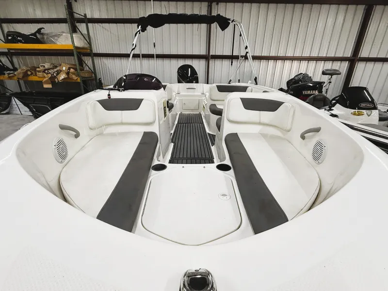 Slide: The Image of 2022 Bayliner Element E18 boat interior with spacious seating and modern design. - 6