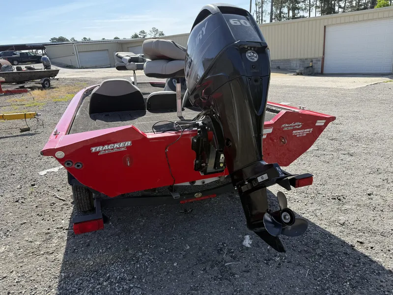 Slide: The Image of 2017 Tracker Pro Team 175 TXW boat with Mercury 60 engine, parked outdoors. - 3