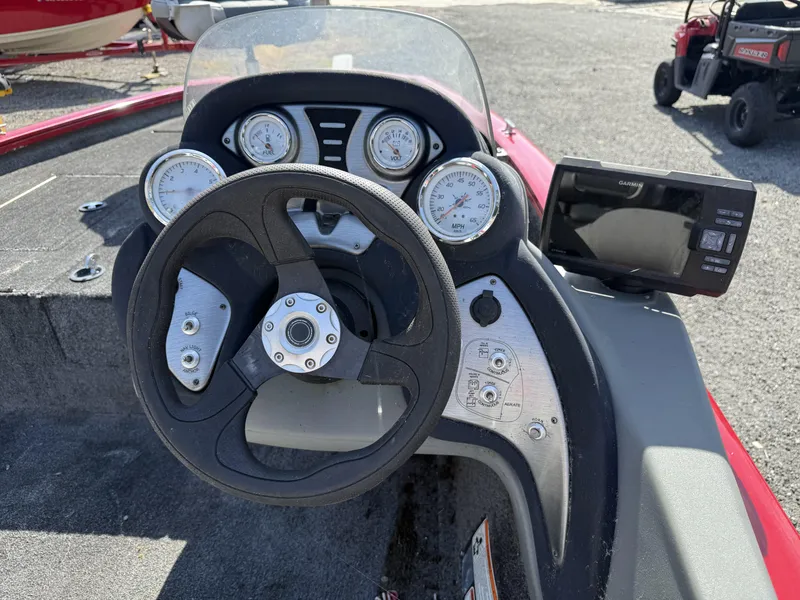Slide: The Image of 2017 Tracker Pro Team 175 TXW boat dashboard with steering wheel and gauges. - 4