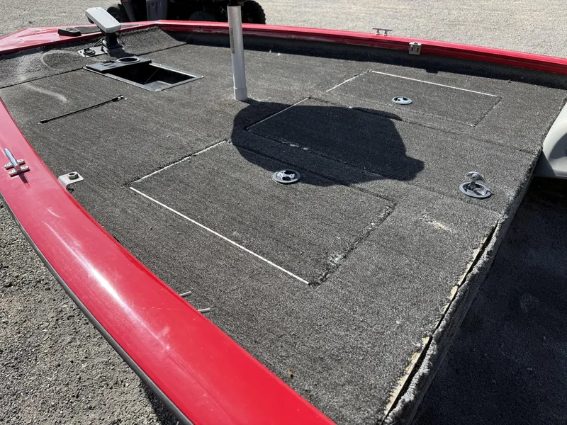 Slide: The Image of 2017 Tracker Pro Team 175 TXW boat deck with red trim and storage compartments. - 7