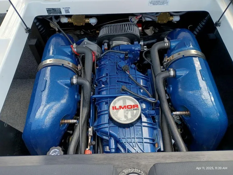 Slide: The Image of 2021 MasterCraft XT20 engine with blue Ilmor components, detailed view. - 13