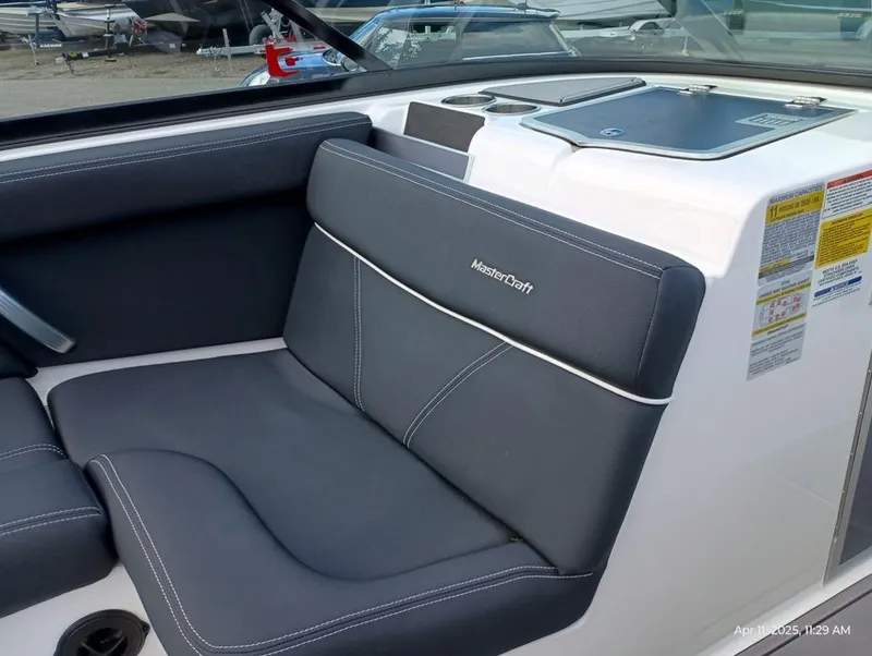 Slide: The Image of 2021 MasterCraft XT20 boat interior with sleek seating and modern design. - 8