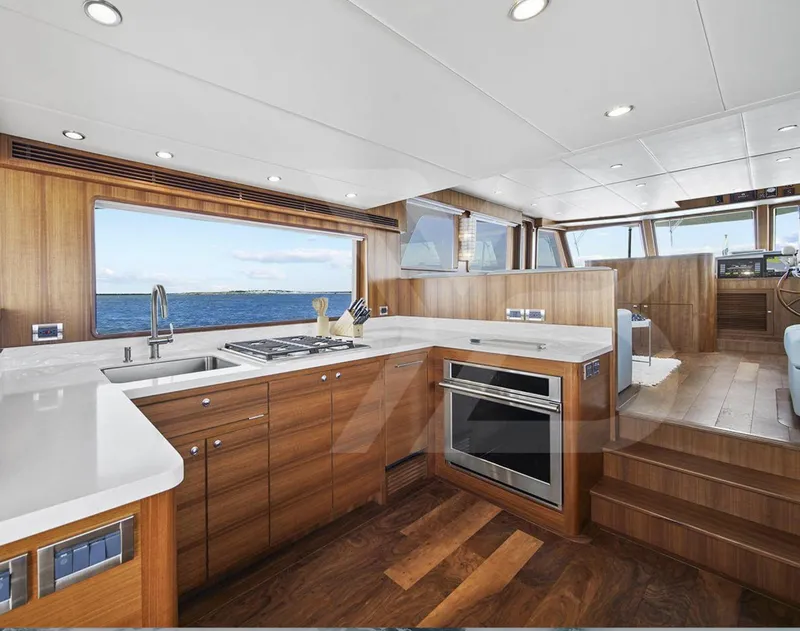 Slide: The Image of Luxurious kitchen interior of 2023 Outer Reef Yachts 720 Azure Motoryacht with ocean view. - 12