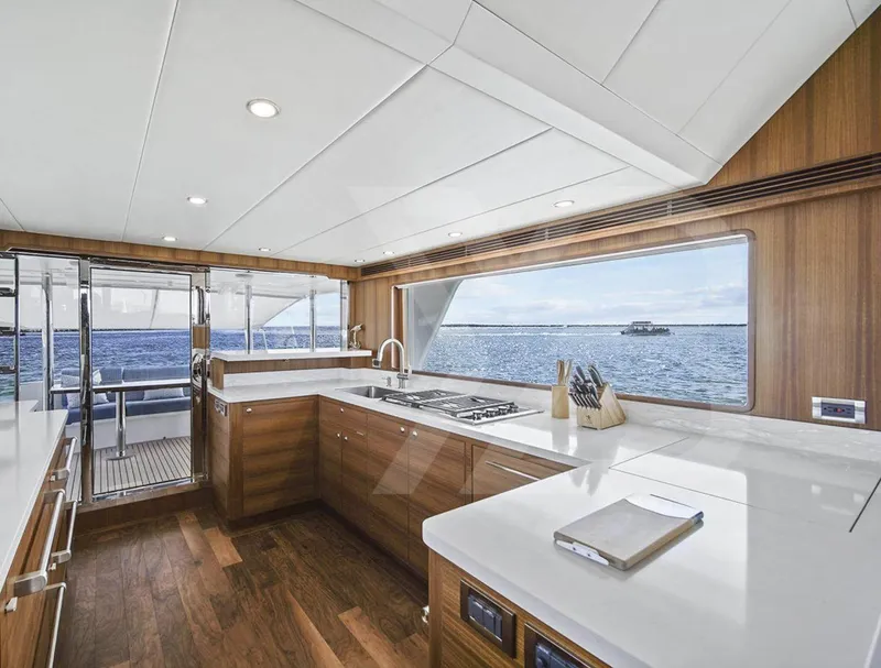 Slide: The Image of Luxurious kitchen interior of 2023 Outer Reef Yachts 720 Azure Motoryacht with ocean view. - 13