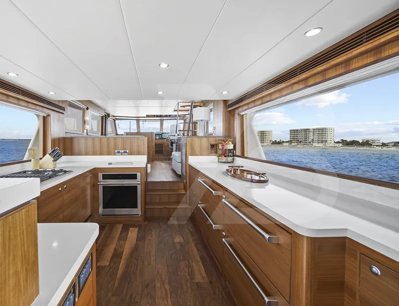 Slide: The Image of 2023 Outer Reef Yachts 720 Azure Custom Cockpit Motoryacht interior with modern kitchen and ocean view. - 15