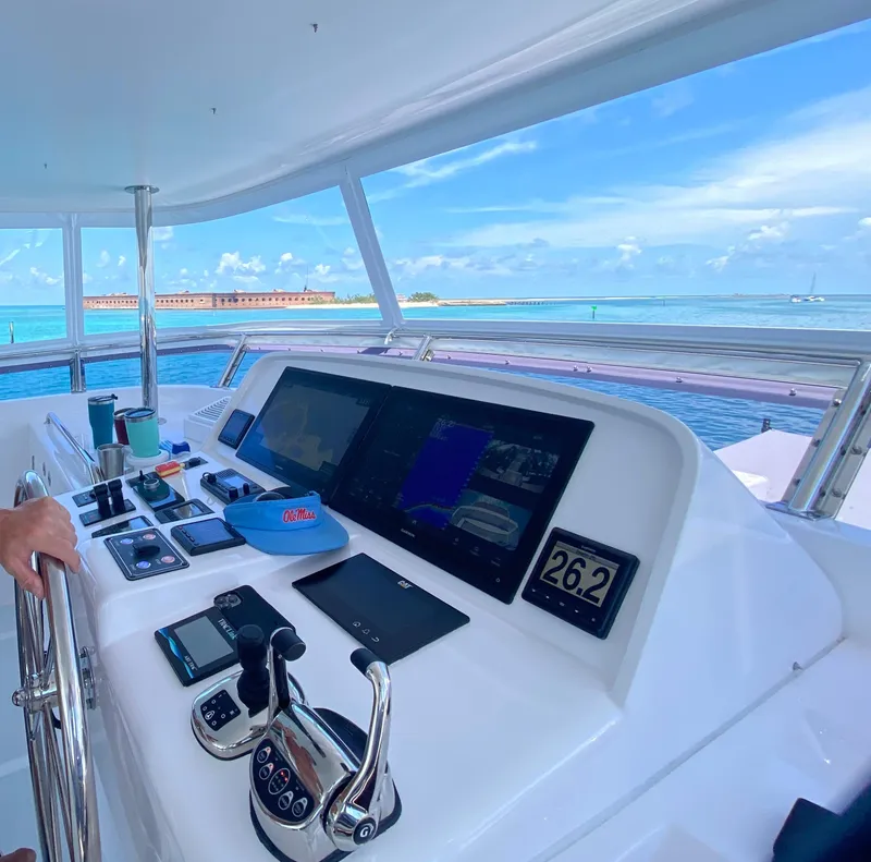 Slide: The Image of Cockpit view of 2023 Outer Reef Yachts 720 Azure Motoryacht, featuring advanced navigation controls. - 25