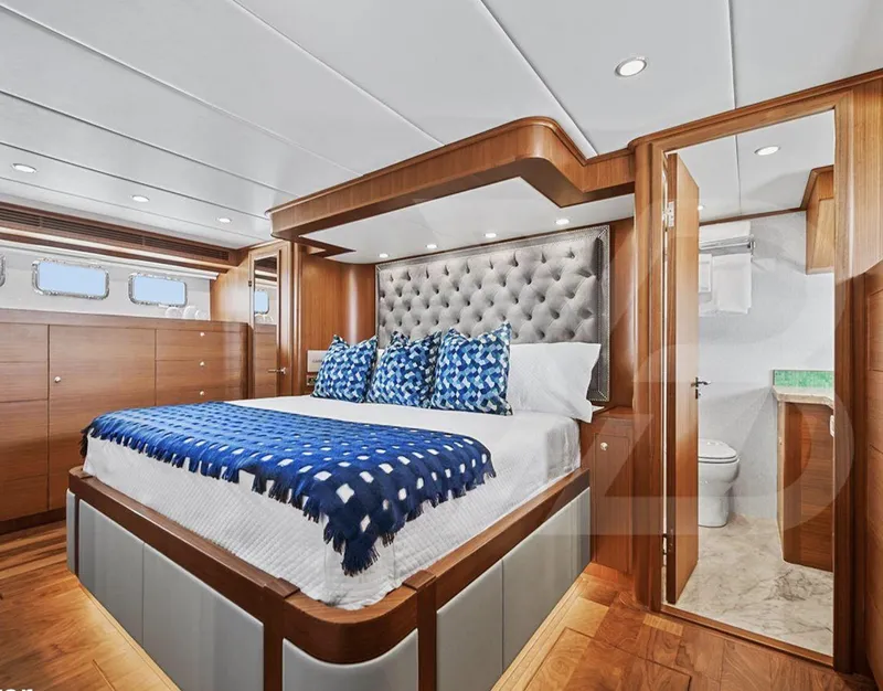 Slide: The Image of Luxurious bedroom in 2023 Outer Reef Yachts 720 Azure Motoryacht, featuring elegant wood finishes. - 28