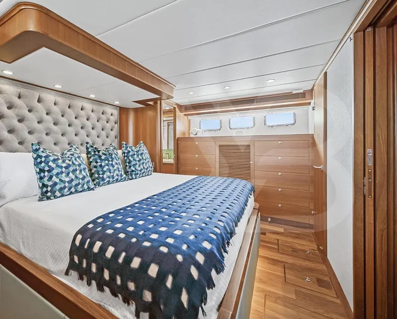 Slide: The Image of Luxurious bedroom in 2023 Outer Reef Yachts 720 Azure Motoryacht, featuring elegant wood finishes. - 29